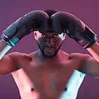 Dramatic fitness headshot of a man in boxing gloves, lit with colorful studio lights against a dark background.