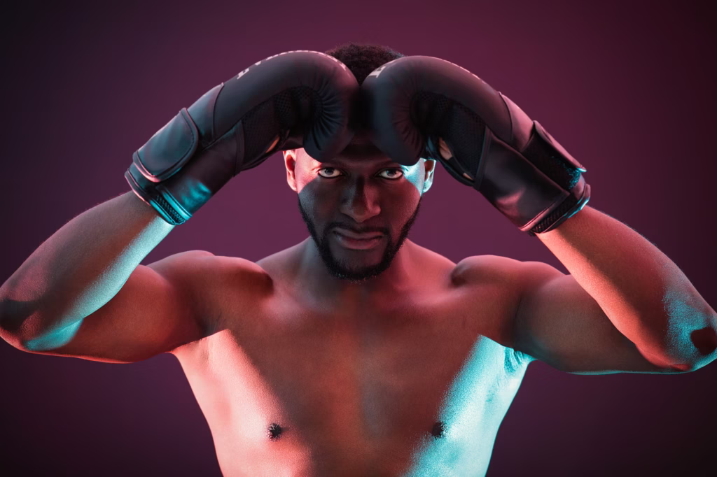 London model portfolio photos - model photography, Man athletic high-drama shirtless black boxing gloves pressed together against forehead stylized lighting cyan magenta rim-lighting dark background muscle definition
