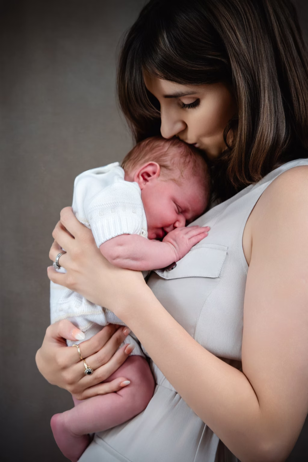 A parent holding their newborn