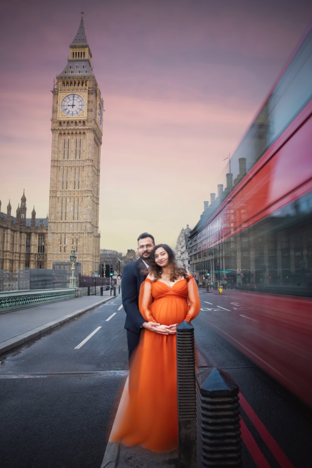 Expectant mother in an orange gown by Westminster