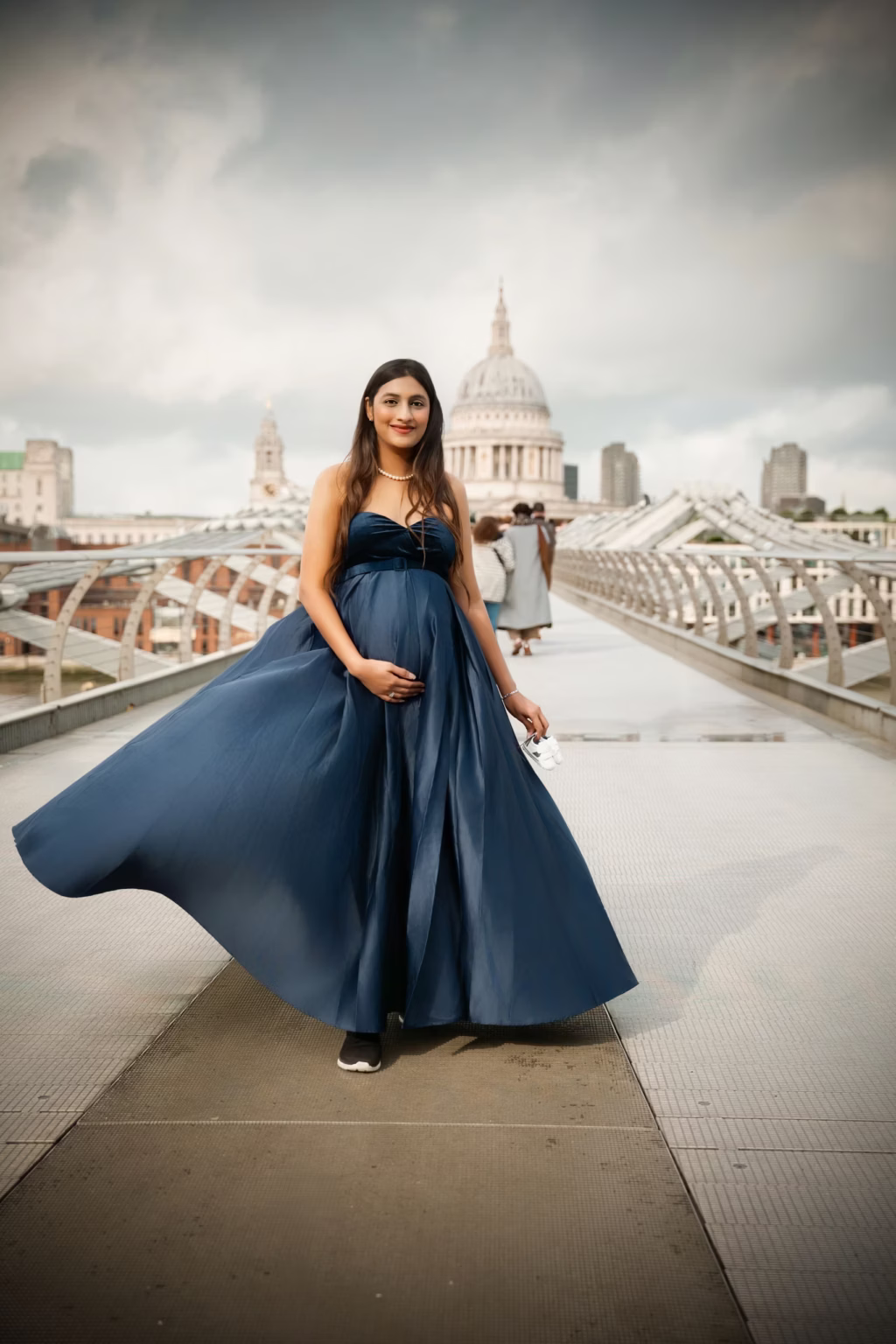 Expectant mother by the river with St Paul’s Cathedral behind